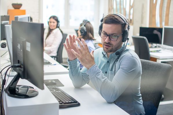 Customer service representative talking to client on phone