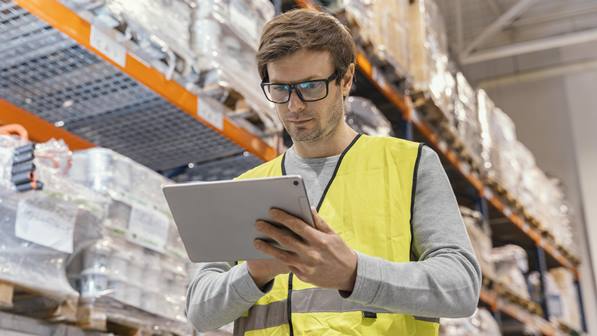 Inventory manager using tablet in warehouse